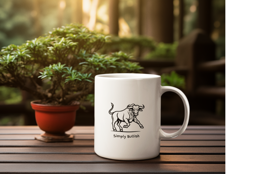A white coffee mug with a bull design  and text that reads Simply Bullish.