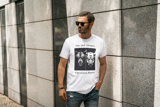 A man wearing a white t-shirt with graphic design of a bear's face side by side with a bull's face with  text that reads The Wall Street ferocious beasts.