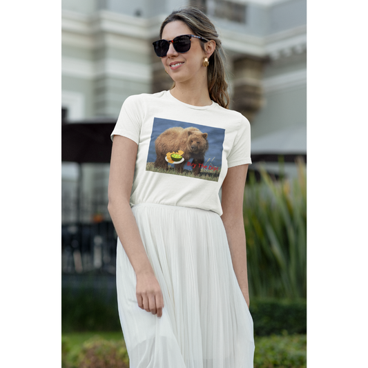 A woman wearing  colorful graphic design of a brown bear and dipping sauce with text that reads Buy The Dip.