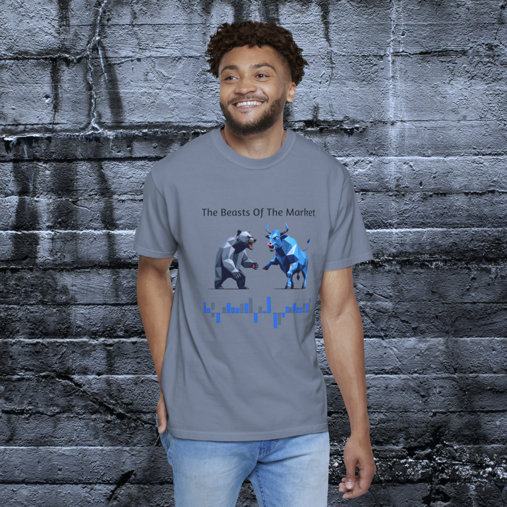 A man wearing a gray shirt with a bear and a bull facing off with  text that reads  The Beasts of the Market.