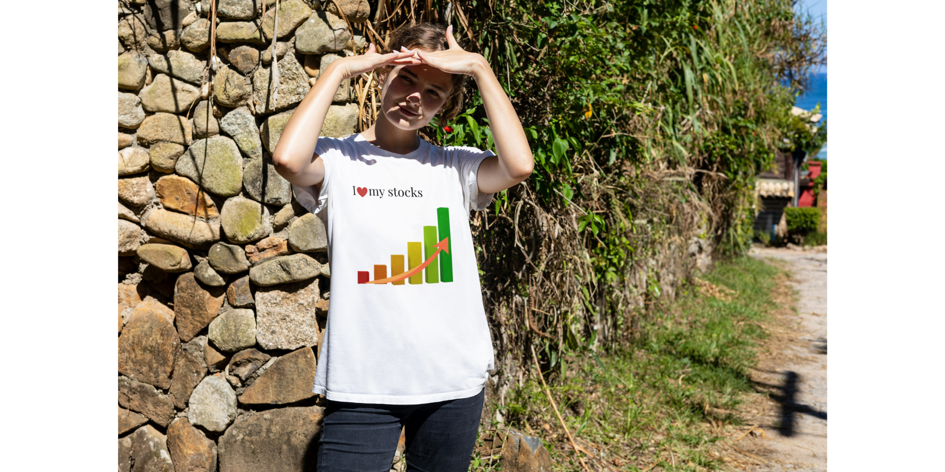 A woman wearing a white t-shirt with a colorful graphic design of a bar chart a text that reads I Love My Stocks.
