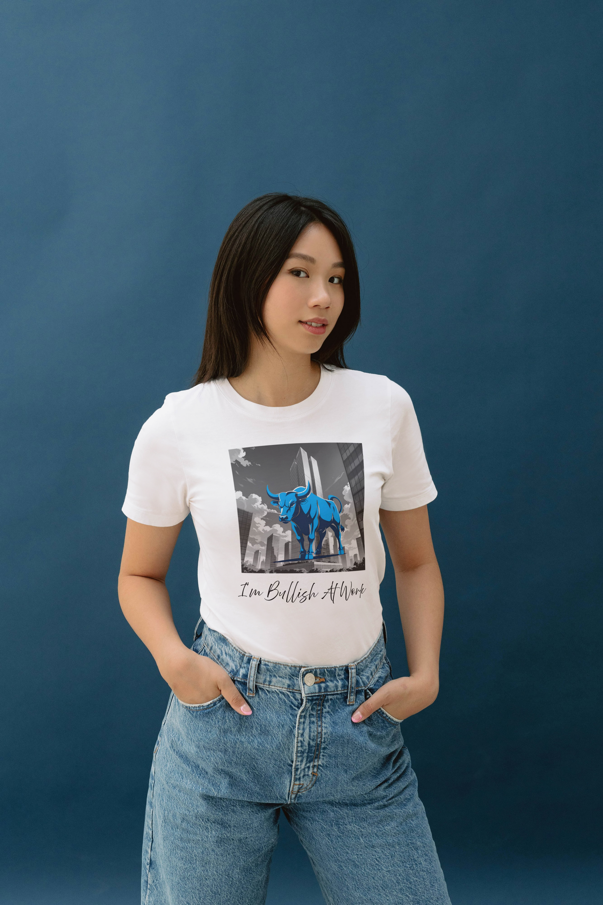  a woman wearing a white t-shirt with a blue bull design and text that reads I'm Bullish At Work.